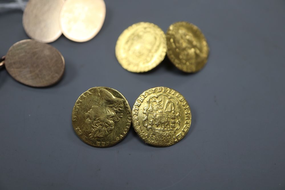 A pair of mounted George III one third guinea cufflinks, gross 10 grams and a pair of yellow metal cufflinks, 10.5 grams.
